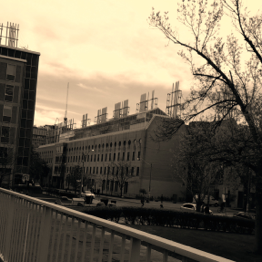 A sepia photograph of a building and trees