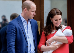 The Duke and Duchess of Cambridge holding baby