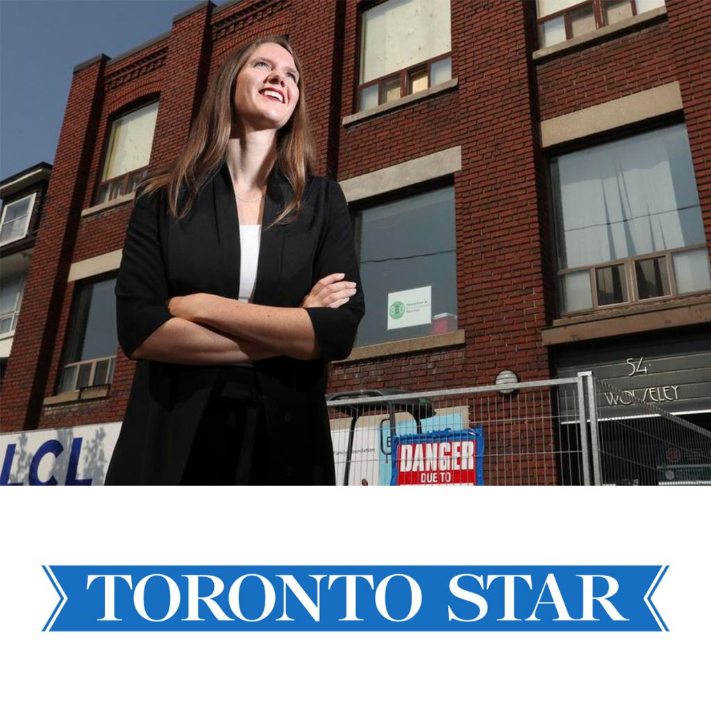A photo of Robyn Whitwham looking up and into the distance with the Stella's Place building behind and underneath is the blue Toronto Star logo