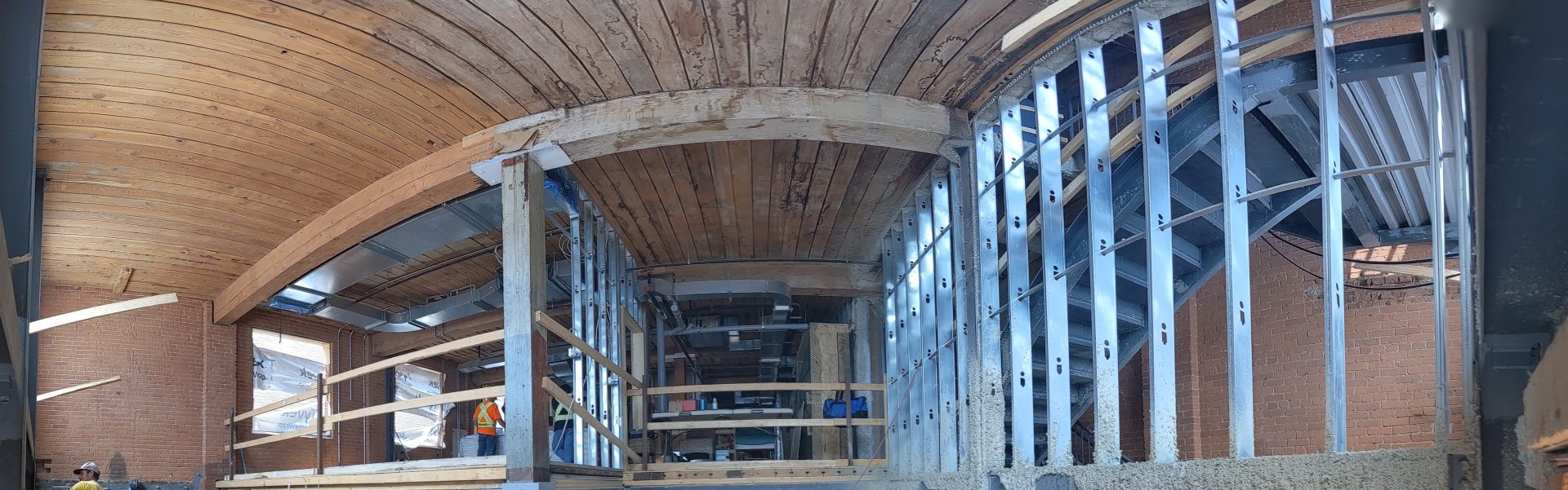 A panorama view of the ceiling and support beams of 54 Wolseley under construction.